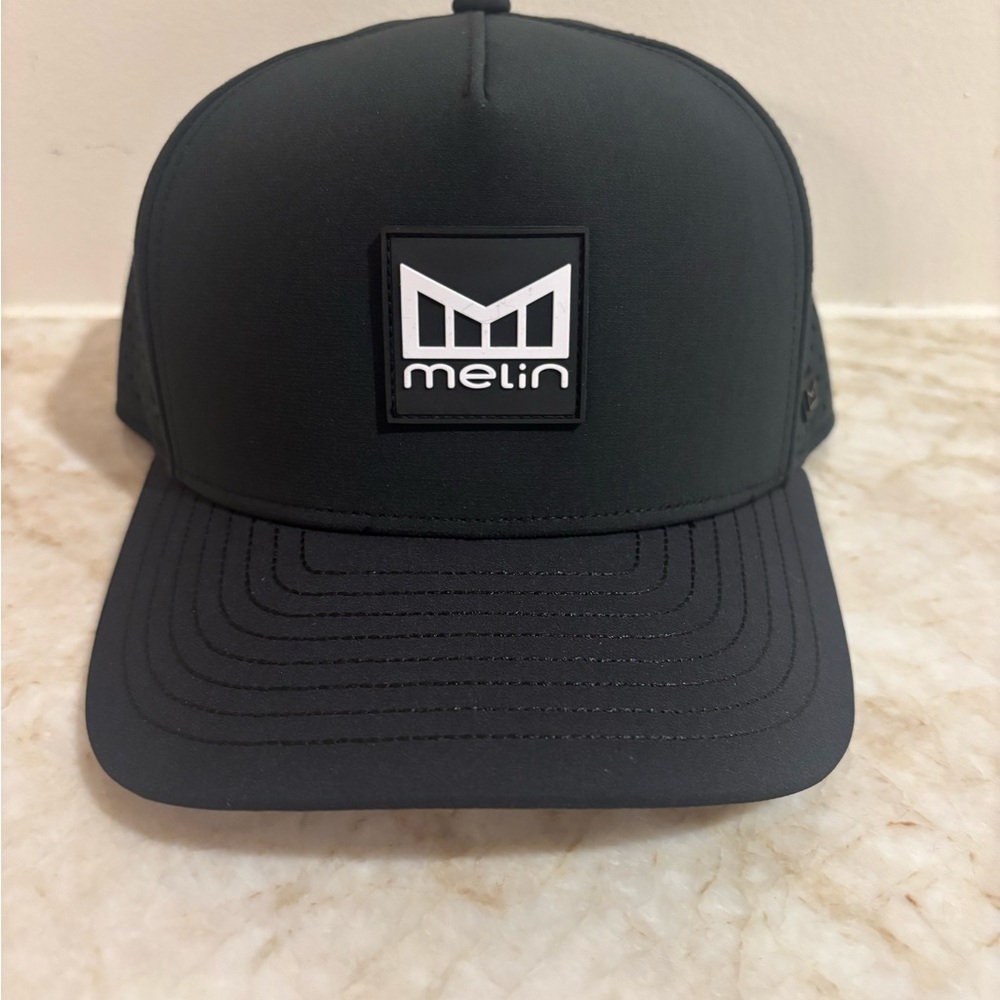 Brand New Melin Odysea Stacked Hydro Hat – Black – Classic Fit